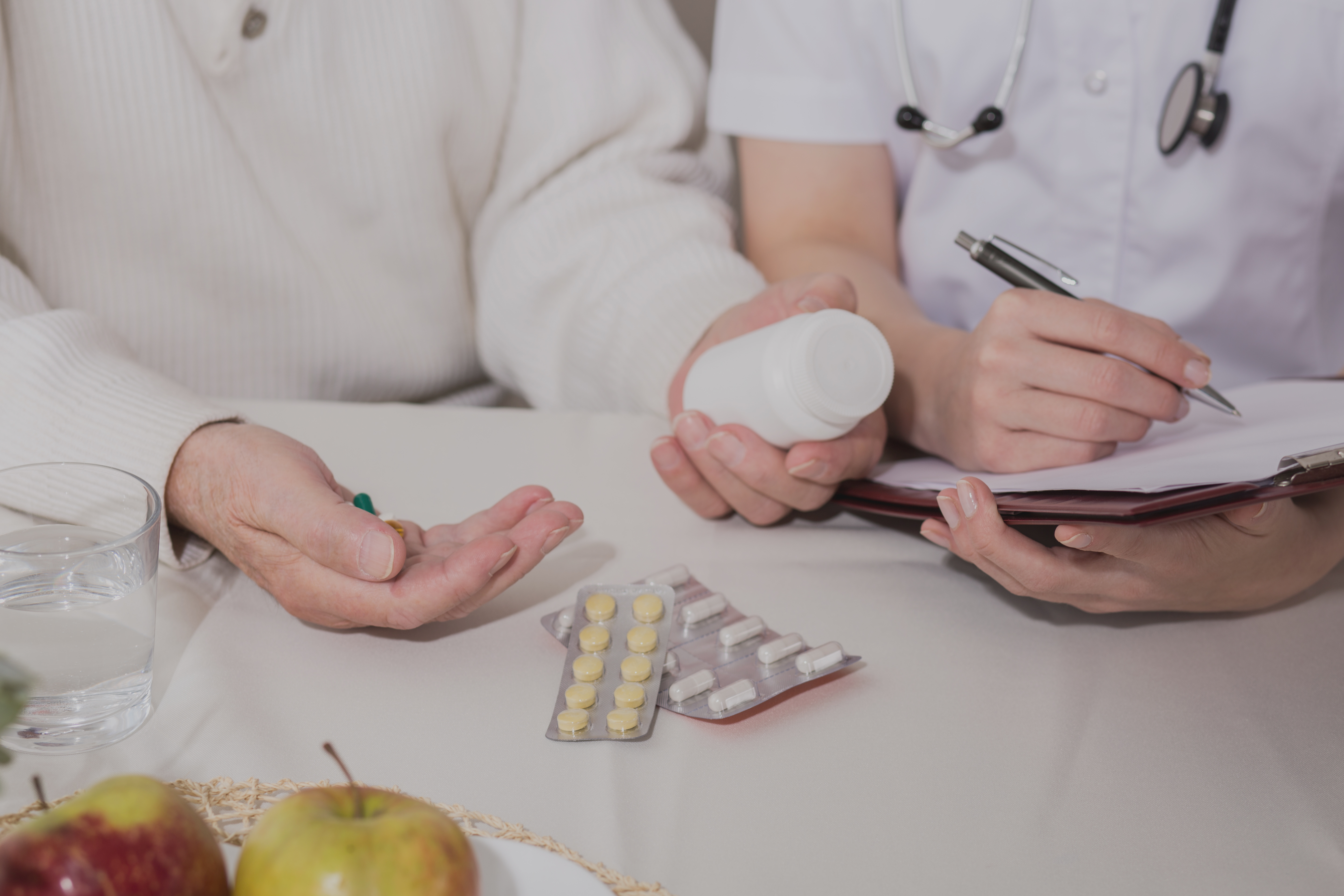 Picture of ill elderly man taking painkillers